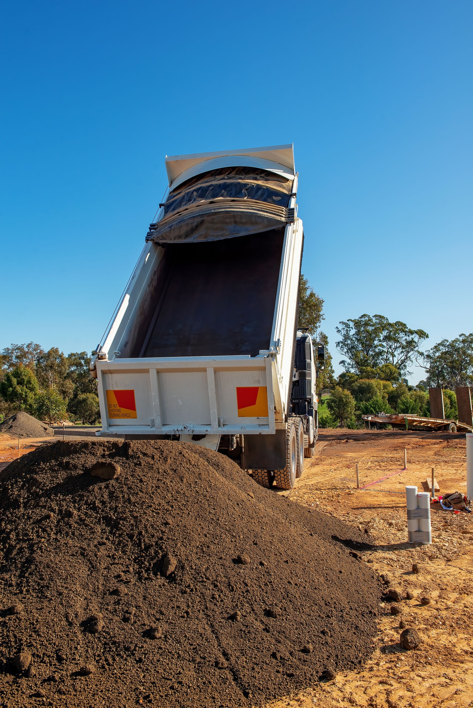 Truck and Trailer dumping gravel